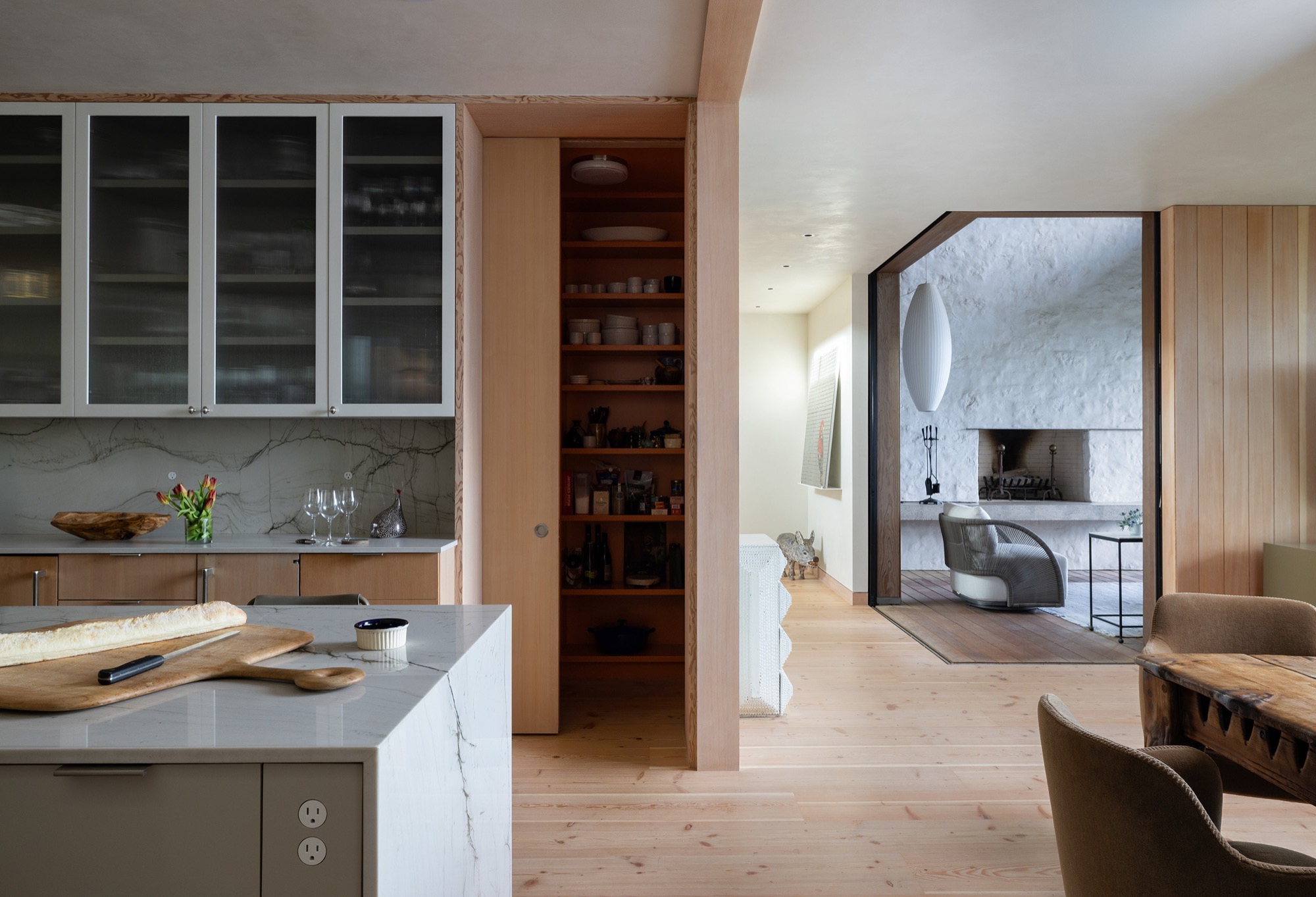 Hillside House kitchen connected to outdoor living in West Lake Hills, Texas